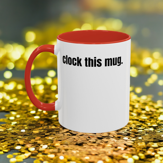 white ceramic mug that says clock this mug sitting in a a pile of glitter